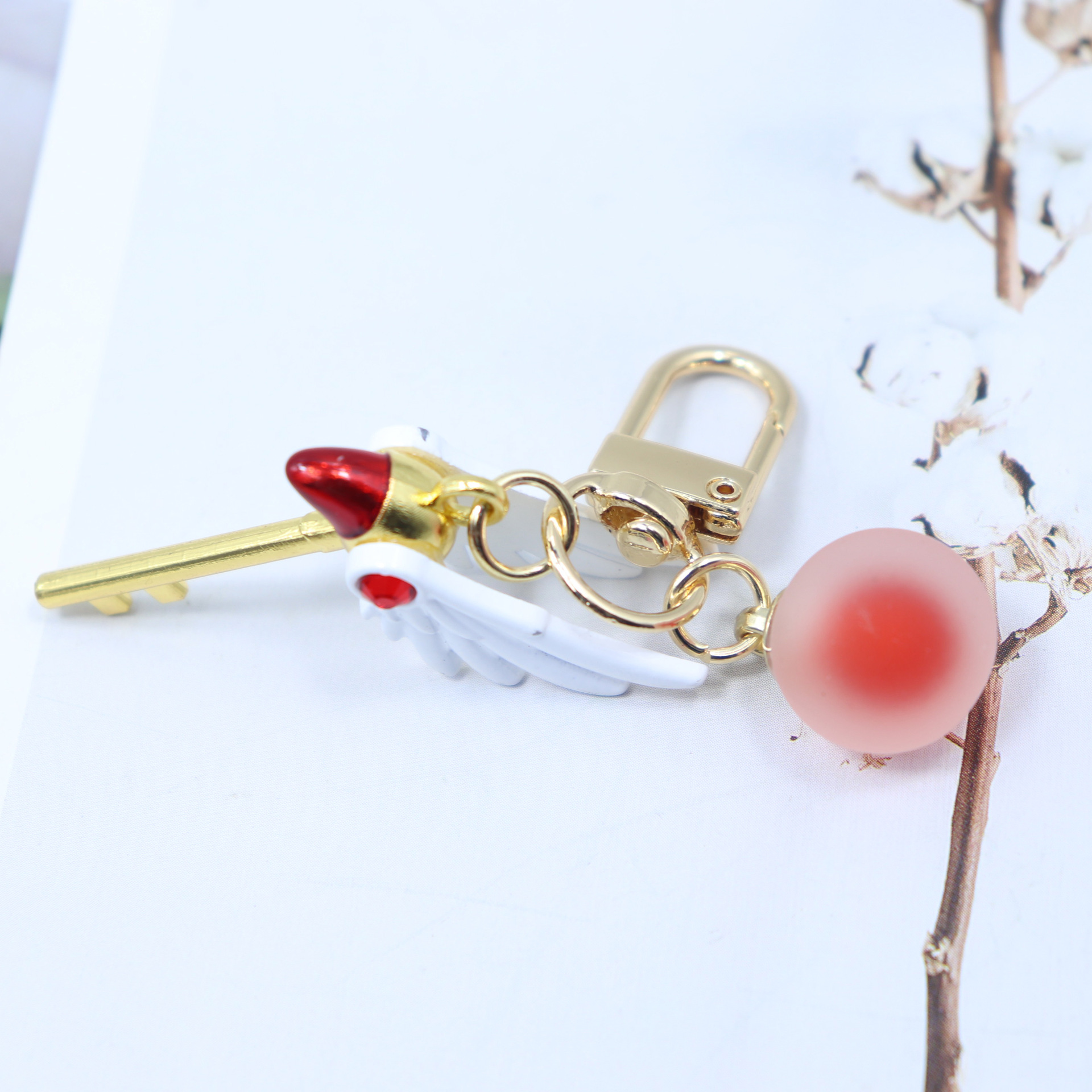 Móc Khóa Mỏ Chim Sakura Có Bi Ngọc