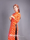 Áo Dài Cô Ba Sài Gòn Cam Chấm Bi