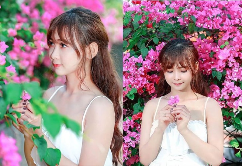 Cầm hoa giấy và cúi mặt