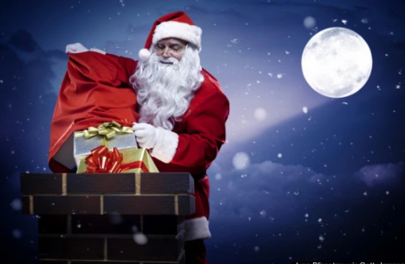 hình ảnh ông già noel chui vào từ ống khối để phát quà cho trẻ